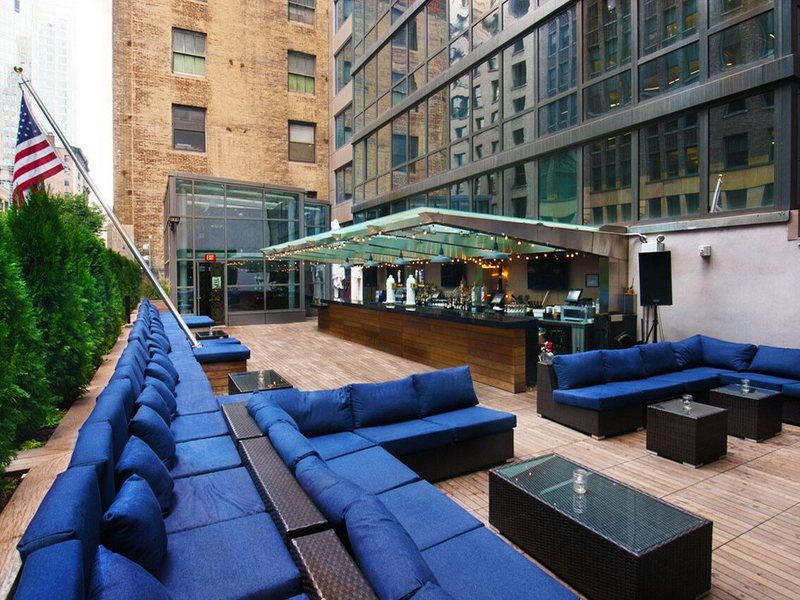 The rooftop terrace and its outdoor bar in daylight