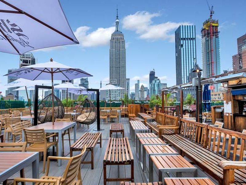 The Ainsworth rooftop terrace with the Empire State Building behind it